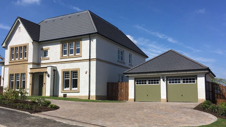 garage door attached to large white house